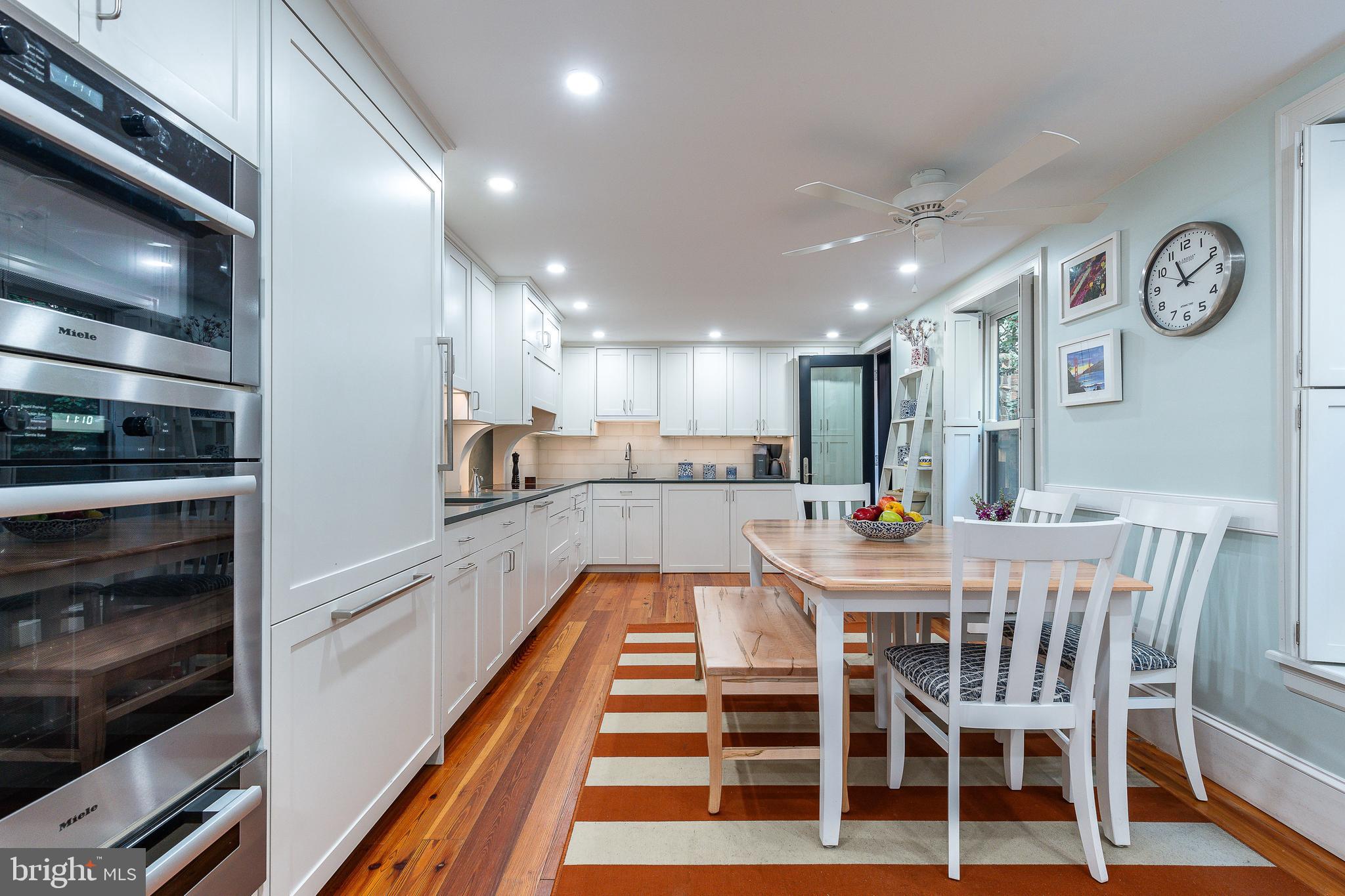 517 Pine Street Philadelphia, PA 19106 - Photo 11 of 63 a large kitchen with a table and chairs