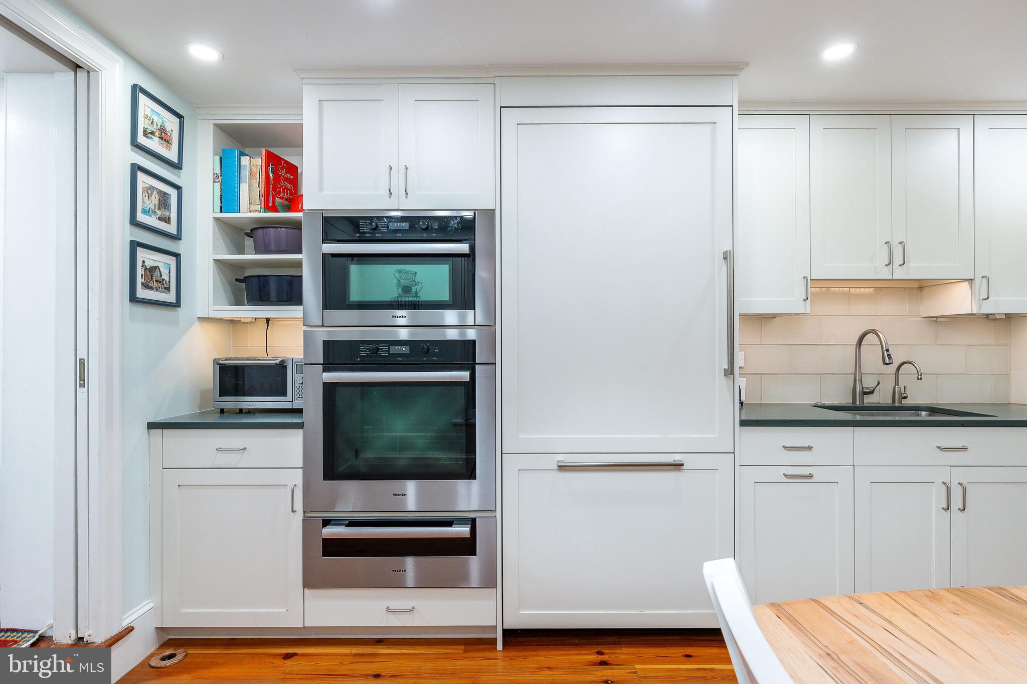517 Pine Street Philadelphia, PA 19106 - Photo 13 of 63 a kitchen with stainless steel appliances cabinets and a table