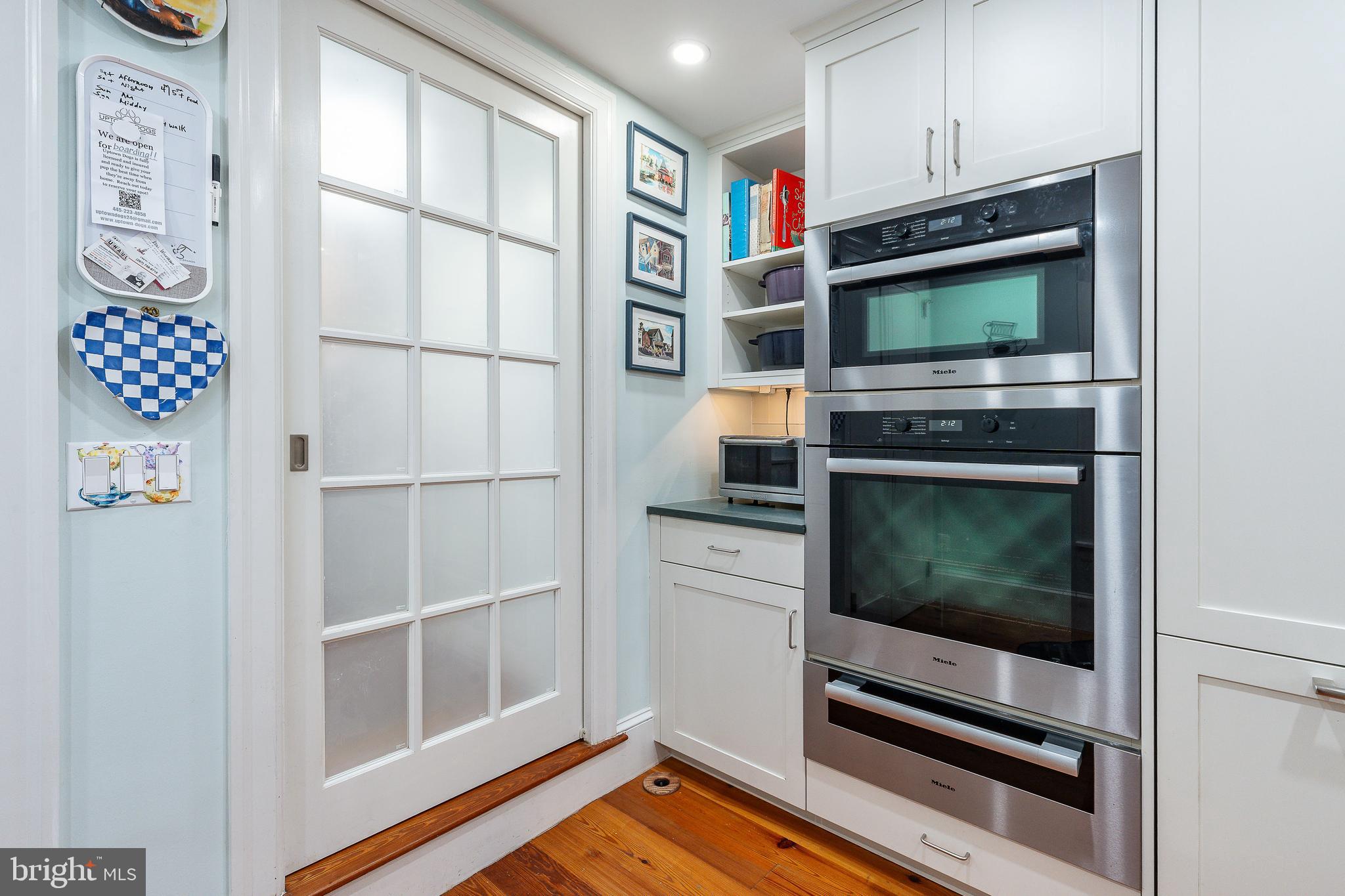 517 Pine Street Philadelphia, PA 19106 - Photo 14 of 63 a kitchen with stainless steel appliances a stove and a microwave