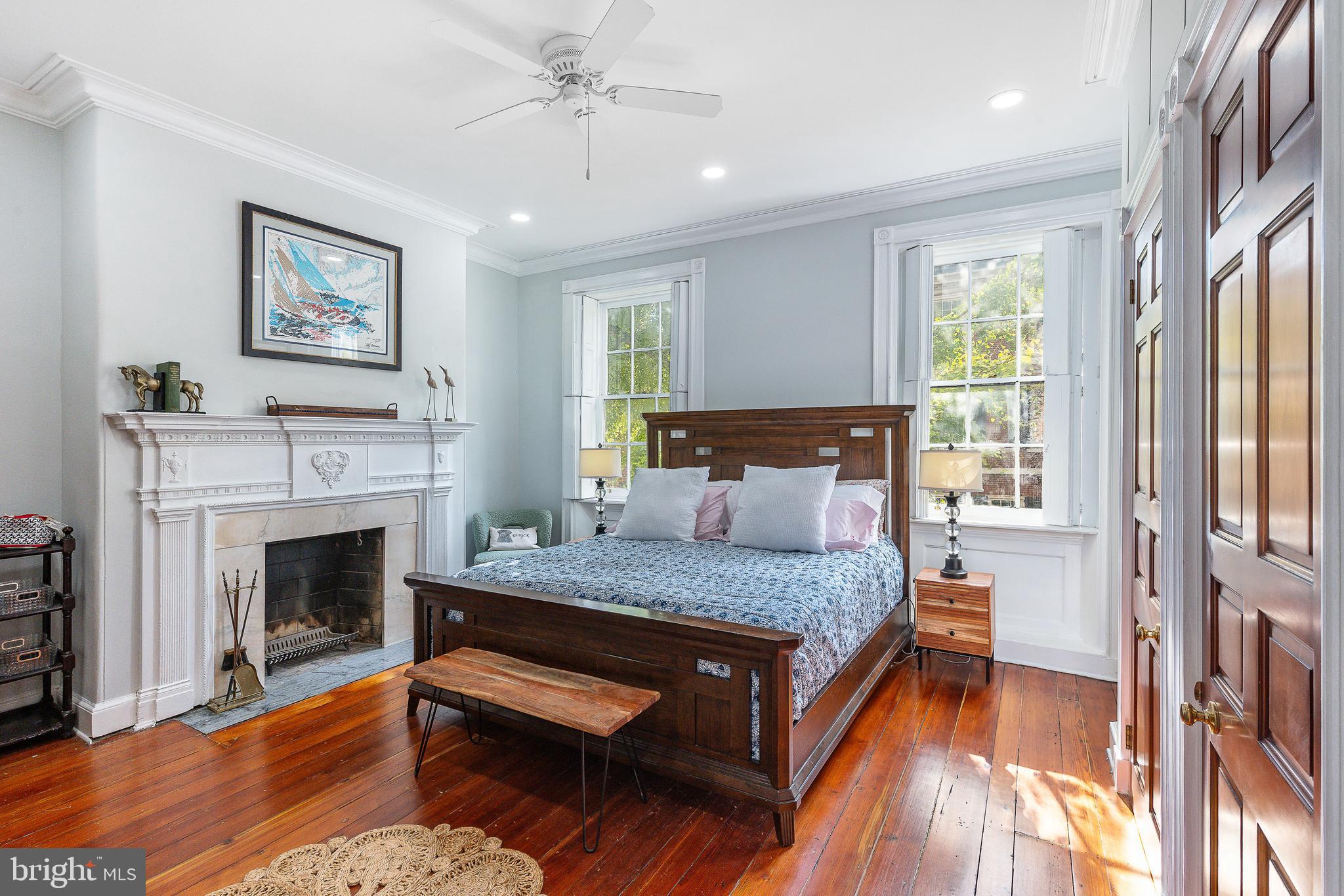 517 Pine Street Philadelphia, PA 19106 - Photo 31 of 63 a bedroom with a bed and a fireplace