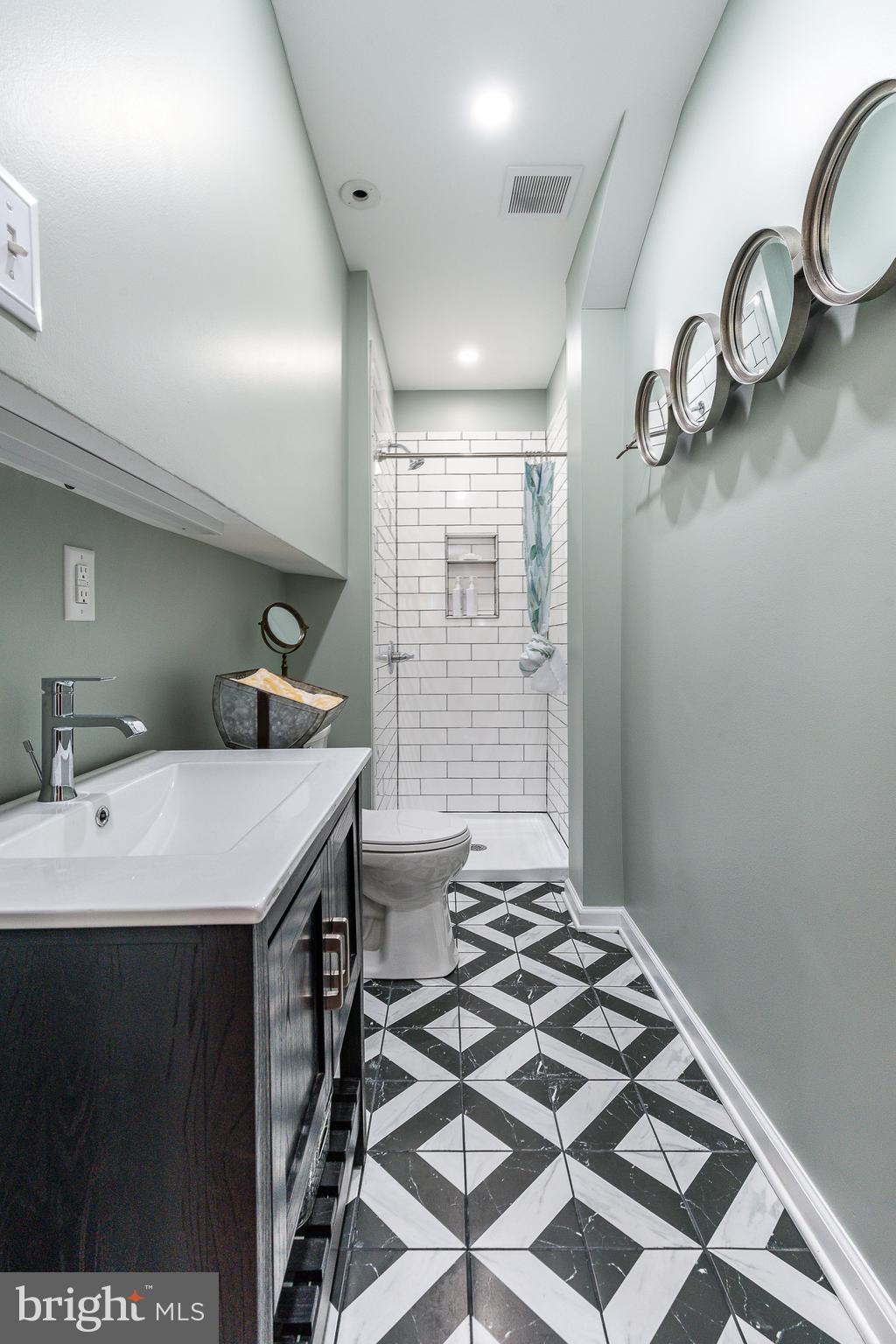 517 Pine Street Philadelphia, PA 19106 - Photo 35 of 63 a bathroom with a sink and a mirror