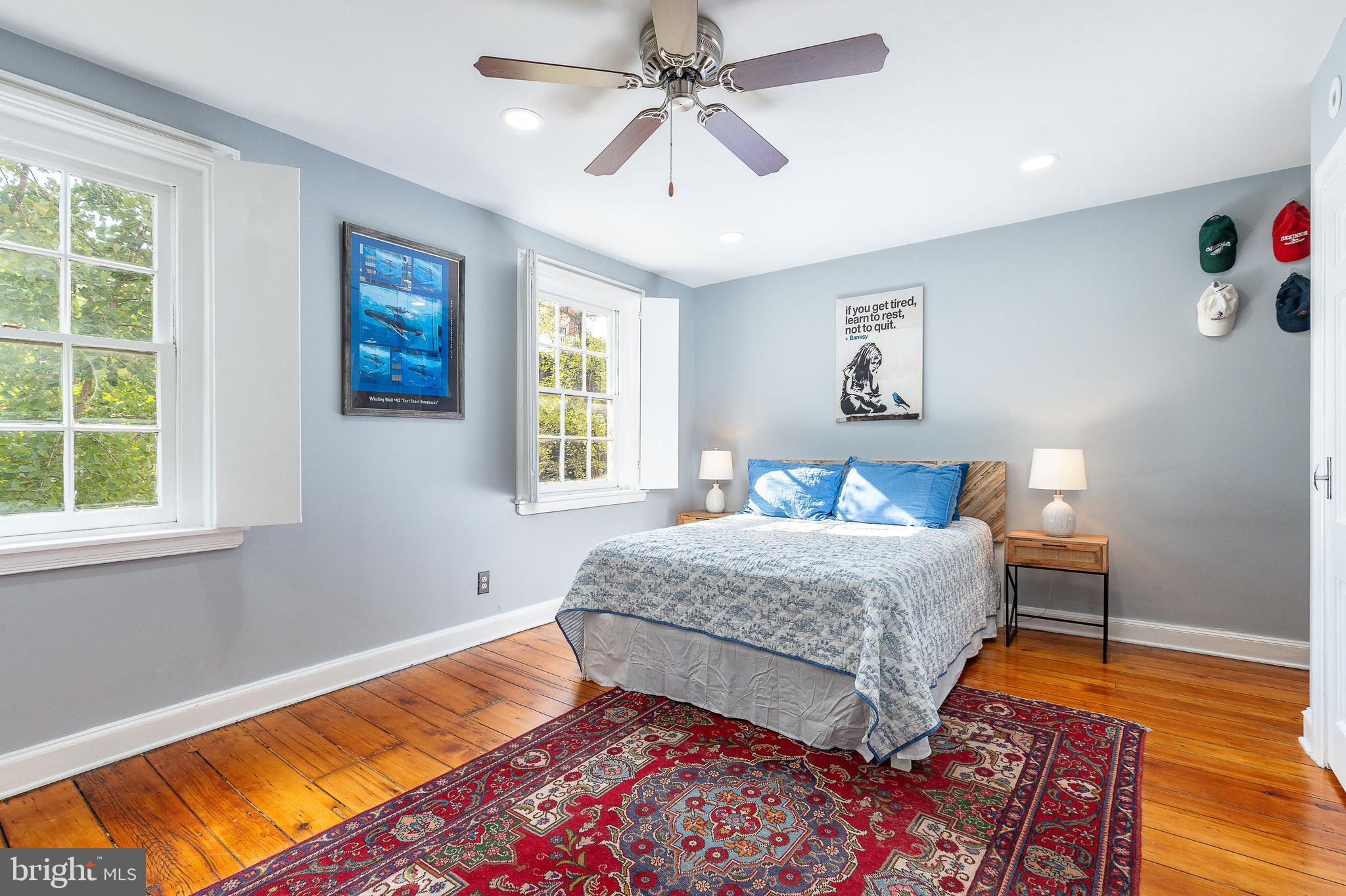 517 Pine Street Philadelphia, PA 19106 - Photo 39 of 63 a bedroom with a bed and a chandelier