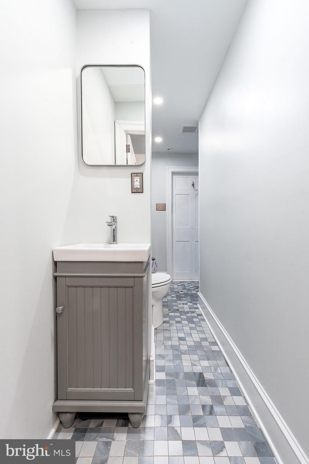 517 Pine Street Philadelphia, PA 19106 - Photo 41 of 63 a bathroom with a sink a toilet and mirror