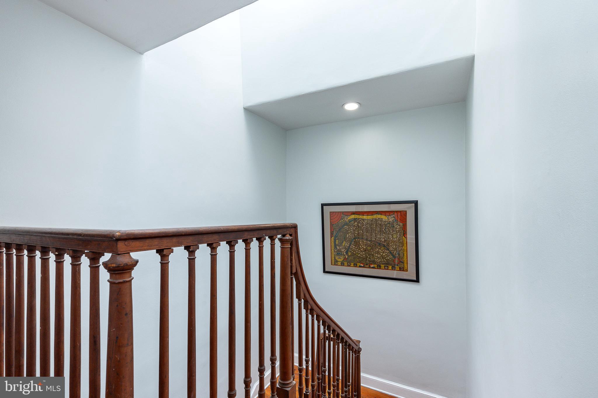 517 Pine Street Philadelphia, PA 19106 - Photo 45 of 63 a view of a hallway with wooden floor and stairs