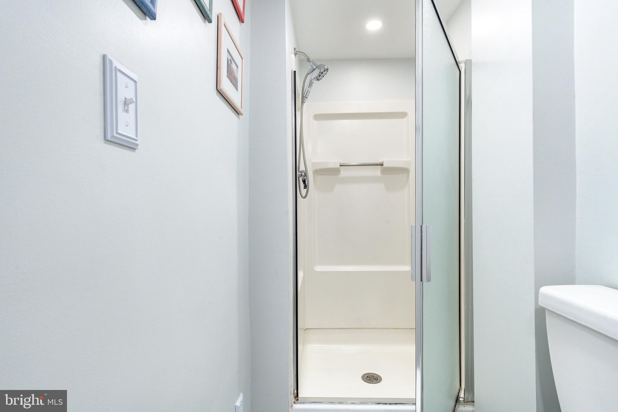 517 Pine Street Philadelphia, PA 19106 - Photo 48 of 63 a bathroom with a glass shower door