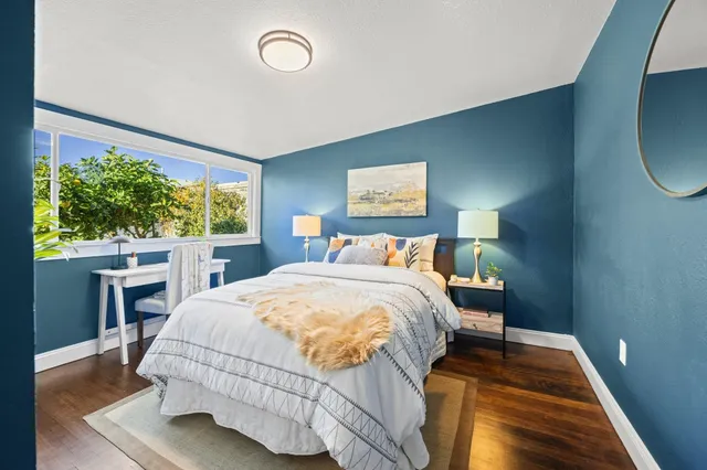 an aerial view of house with yard and mountain view in back