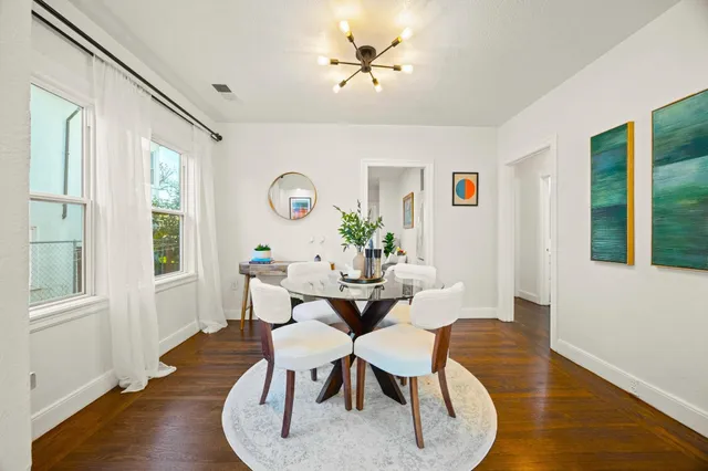 a view of a dining room with furniture window and wooden floor