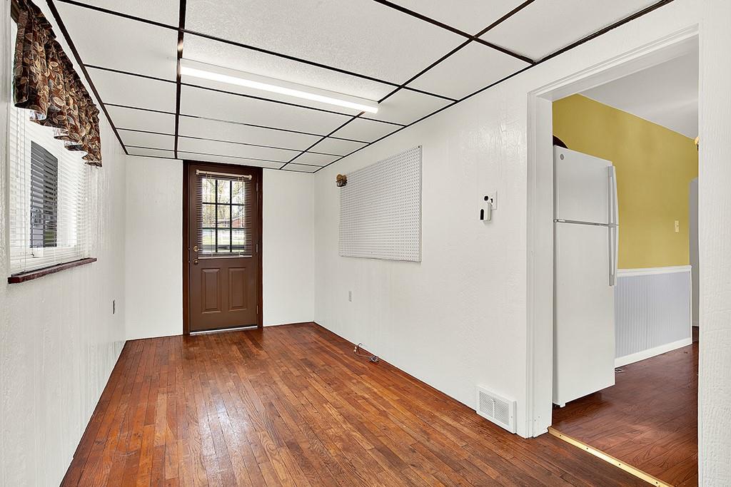 10970 Old Trail Road Irwin, PA 15642 - Photo 11 of 20 a view of empty room with wooden floor and cabinet