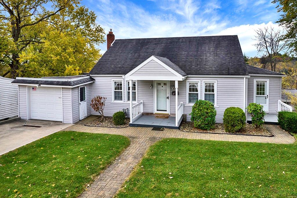 10970 Old Trail Road Irwin, PA 15642 - Photo 19 of 20 a front view of a house with a yard and porch