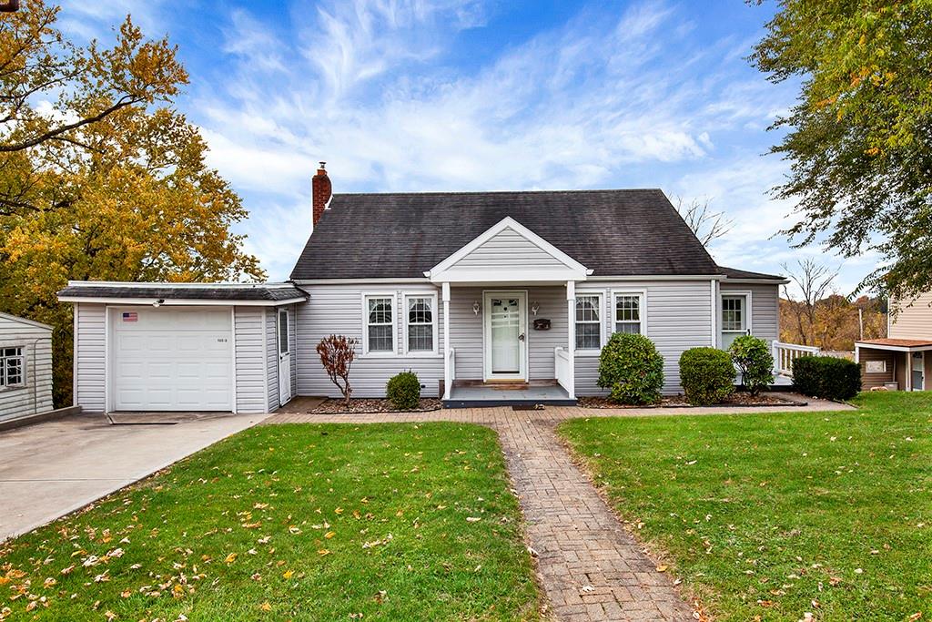 10970 Old Trail Road Irwin, PA 15642 - Photo 2 of 20 a front view of a house with a yard and trees