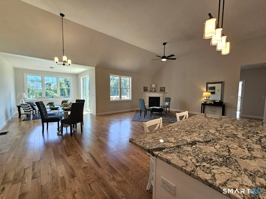 80 Aldrich Road Putnam, CT 06260 - Photo 13 of 23 a view of a a dining room with furniture window and wooden floor