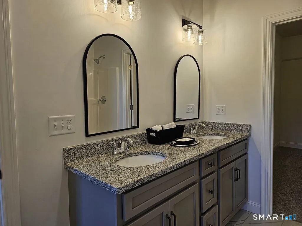 80 Aldrich Road Putnam, CT 06260 - Photo 16 of 23 a bathroom with a granite countertop sink a mirror and vanity