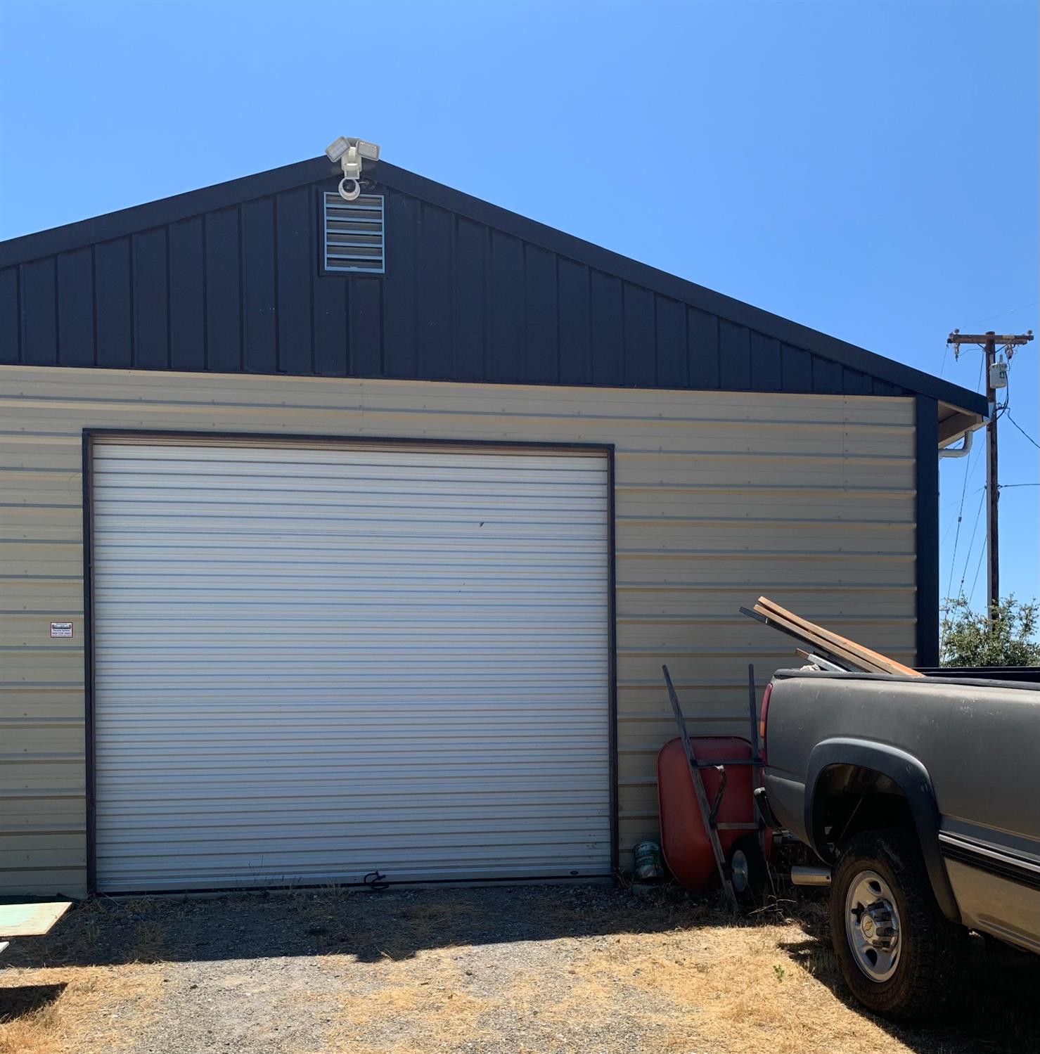 17958 Creations Way Mountain Ranch, CA 95245 - Photo 11 of 28 Roll-up power door into oversized garage and full workshop.