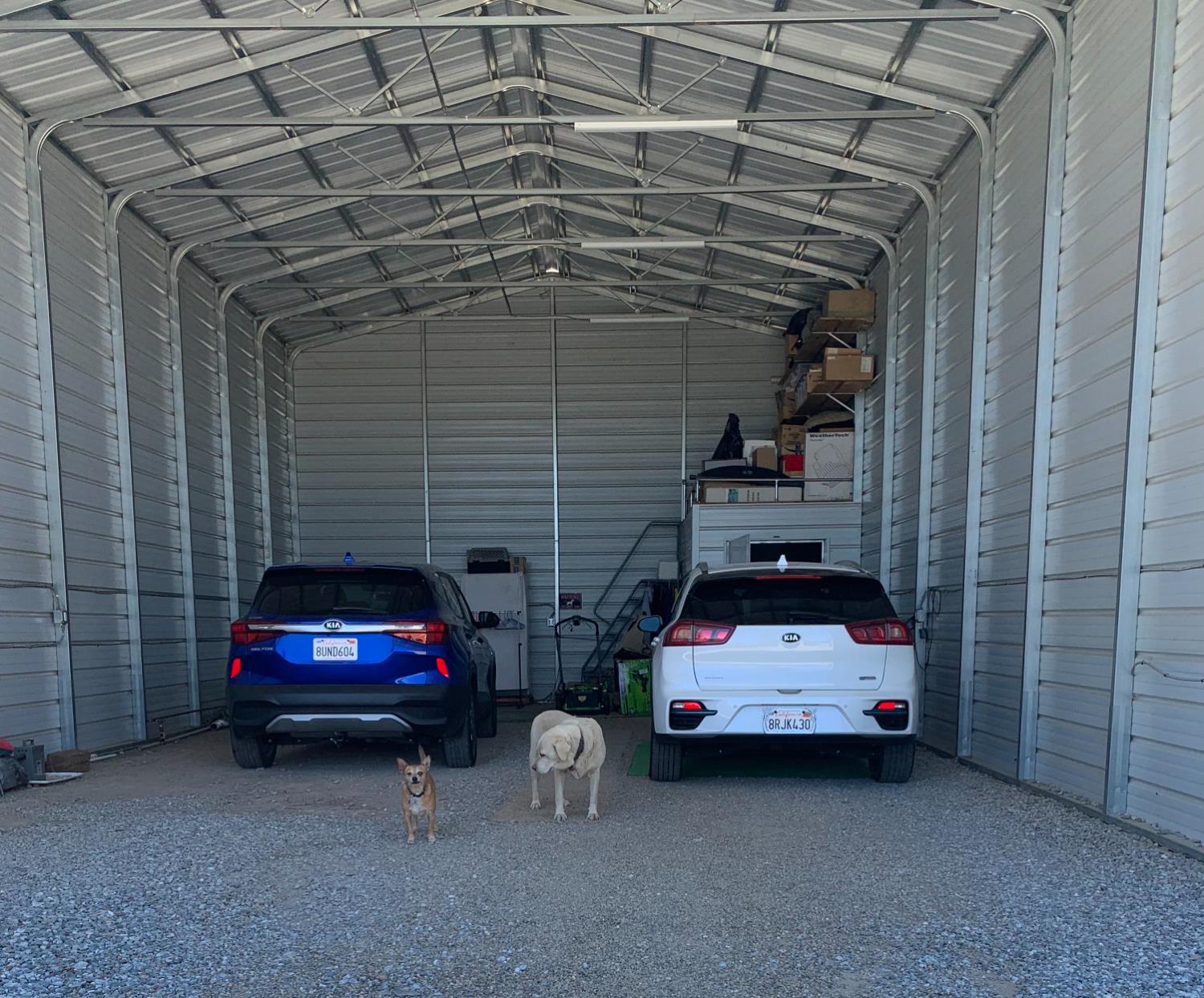 17958 Creations Way Mountain Ranch, CA 95245 - Photo 12 of 28 RV barn with solar system charging array on roof, battery room in far right corner. Dog and cat patrolling the property do not stay!