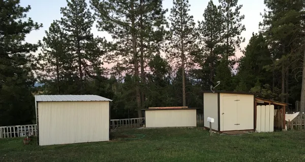 a view of a swimming pool with a yard
