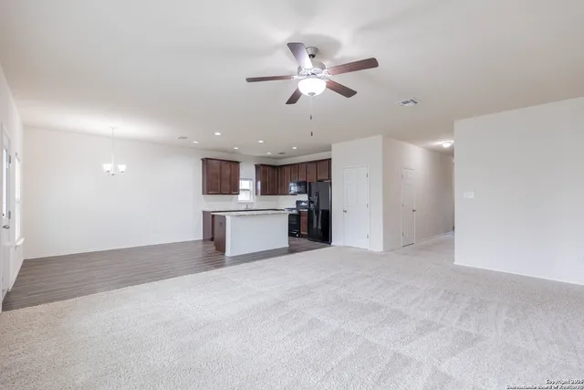a view of a kitchen with a sink and cabinet