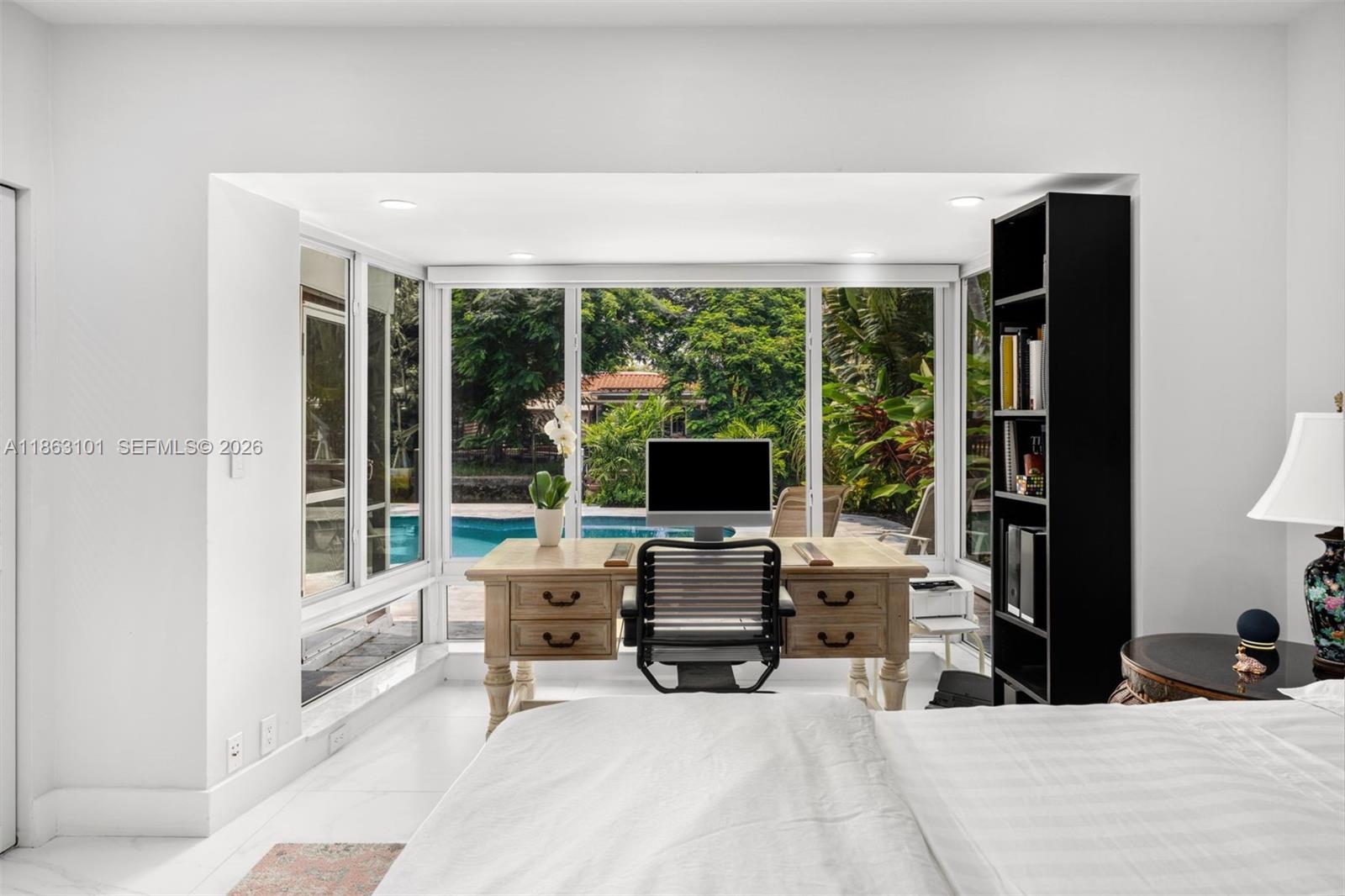 1410 Cleveland Road Miami Beach, FL 33141 - Photo 14 of 17 a view of a workspace with furniture and a window