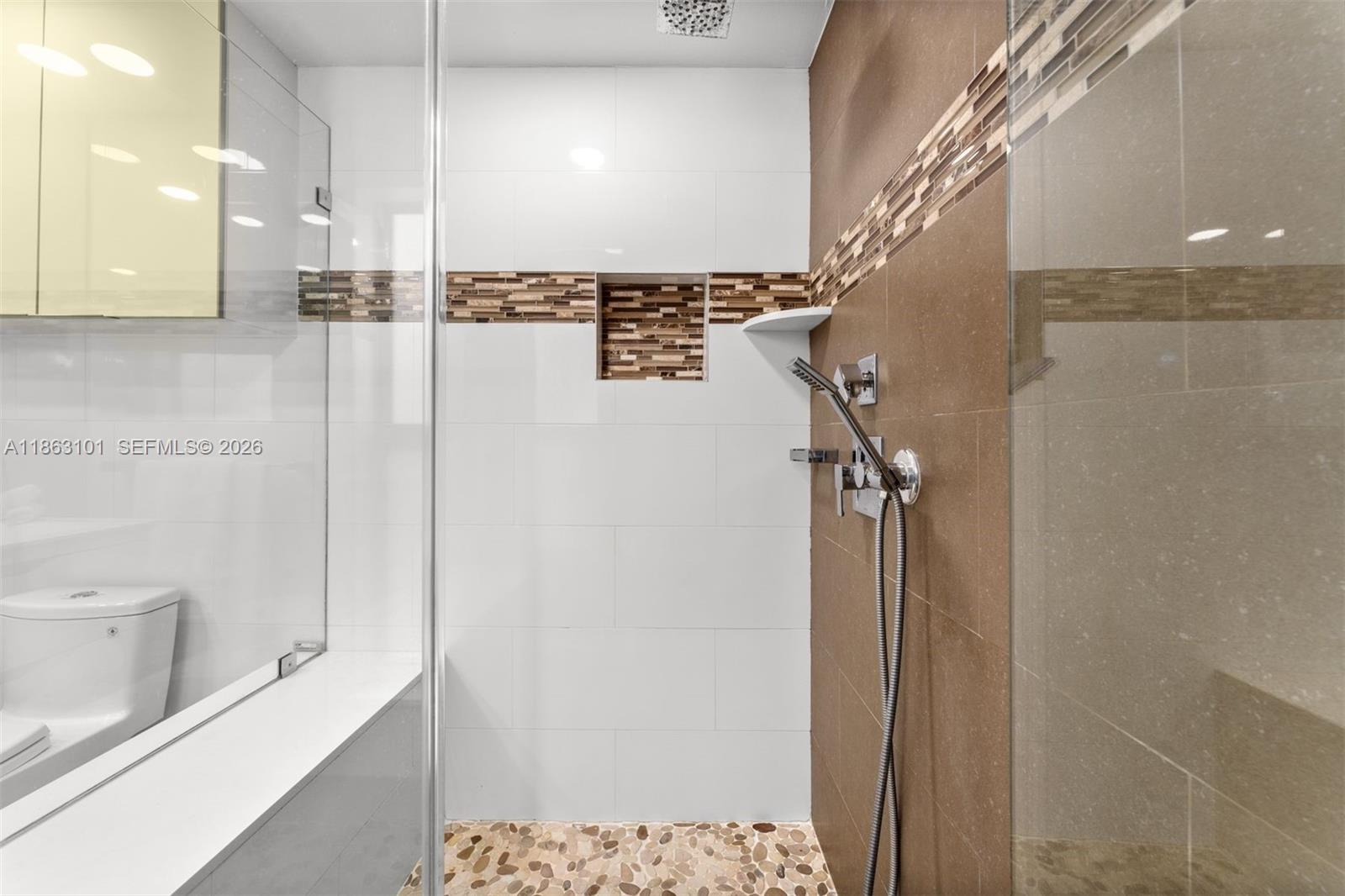 1410 Cleveland Road Miami Beach, FL 33141 - Photo 16 of 17 a view of a bathroom with a shower