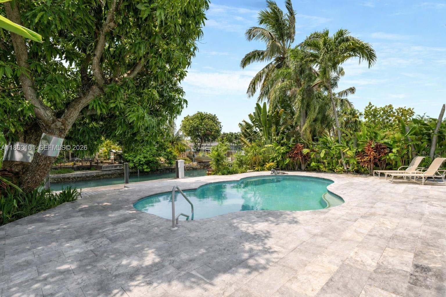 1410 Cleveland Road Miami Beach, FL 33141 - Photo 17 of 17 a view of a swimming pool with a yard