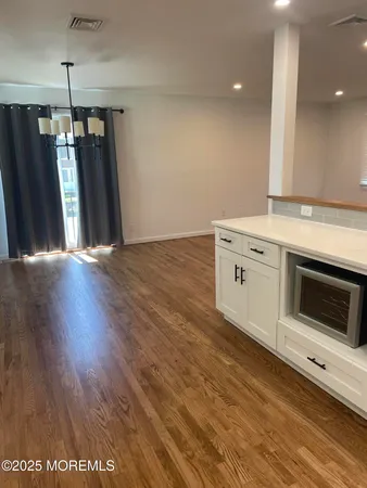 a view of a kitchen with a sink and a stove