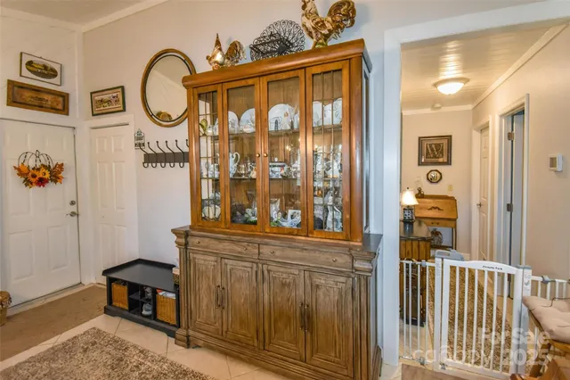 a view of a porch with a table and chairs