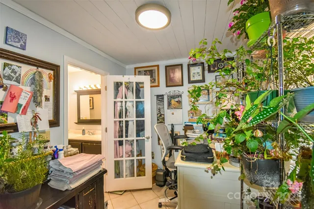 a balcony with furniture and flowers