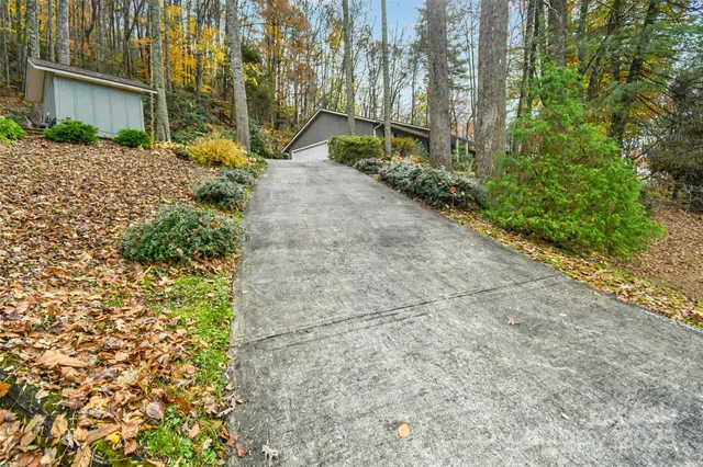 a pathway of a house with a yard