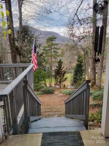 a view of balcony with wooden floor and fence