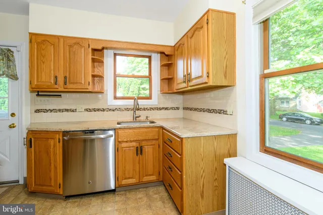 a kitchen with a sink and a window