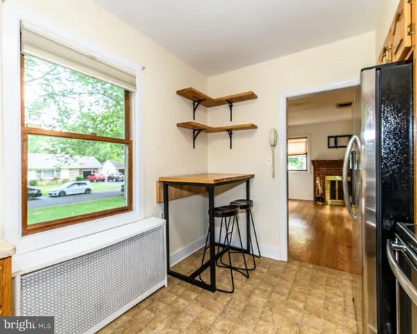 a view of a livingroom with furniture and a window