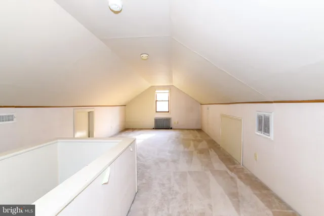 a view of empty room with windows