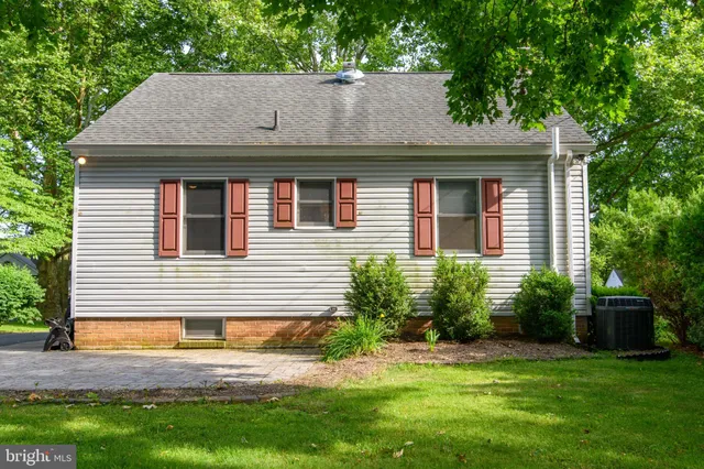 a aerial view of a house with a yard