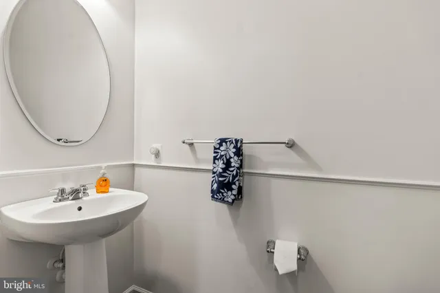 a bathroom with a sink and mirror