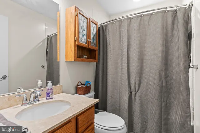 a living room with a bed furniture and a window