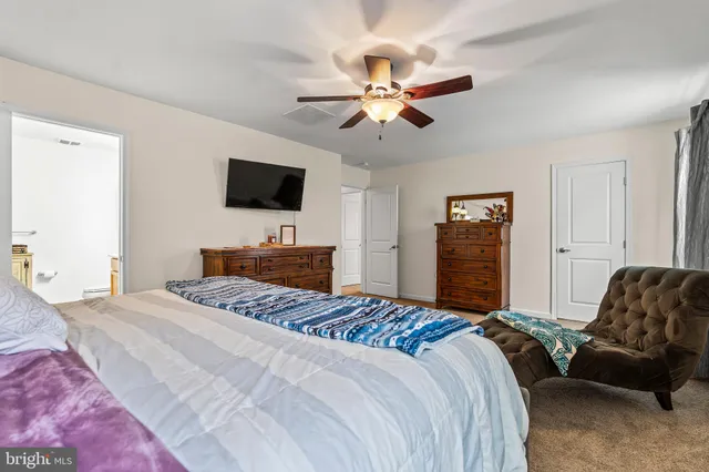 a view of a livingroom with furniture and cabinet