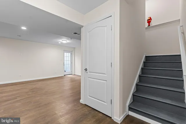a view of a room with furniture and a ceiling fan