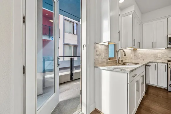a bathroom with a sink vanity and mirror