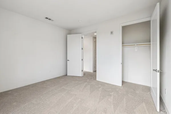 a front view of a house with swimming pool and yard