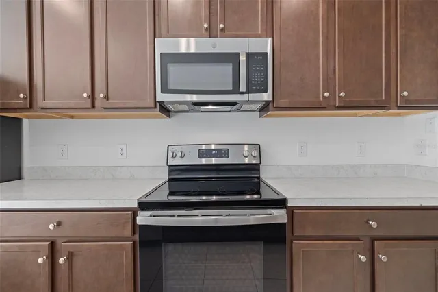 a bathroom with a sink a light fixture and a mirror
