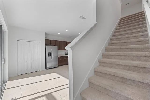a bedroom with a bed and a potted plant