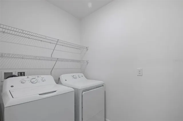 a view of a lake with houses in the back