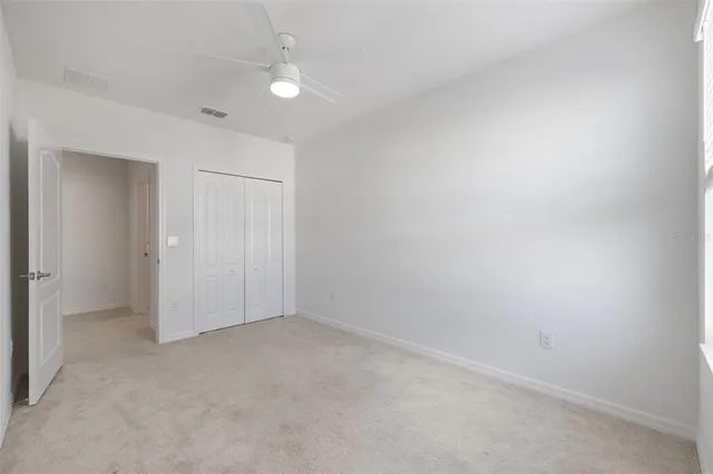 a view of potted plants in front of a building