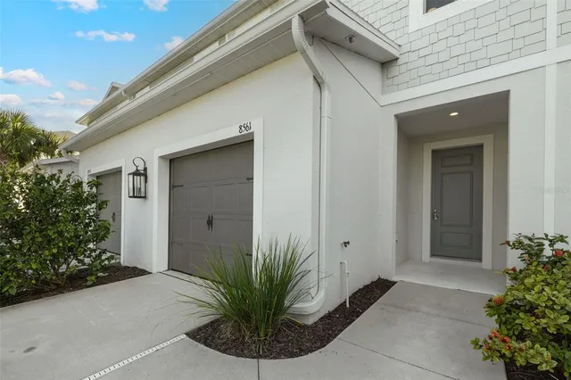 an empty room with a ceiling fan and a window