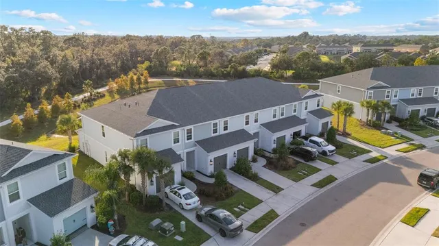 an aerial view of a city with lots of residential buildings