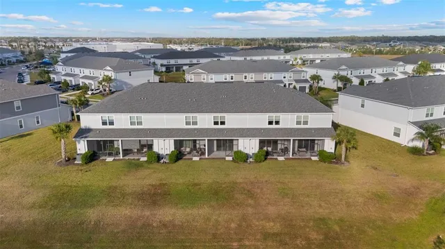 an aerial view of a house with a ocean view