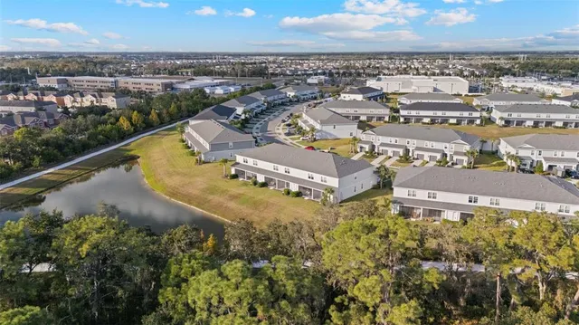 an aerial view of a house with outdoor space