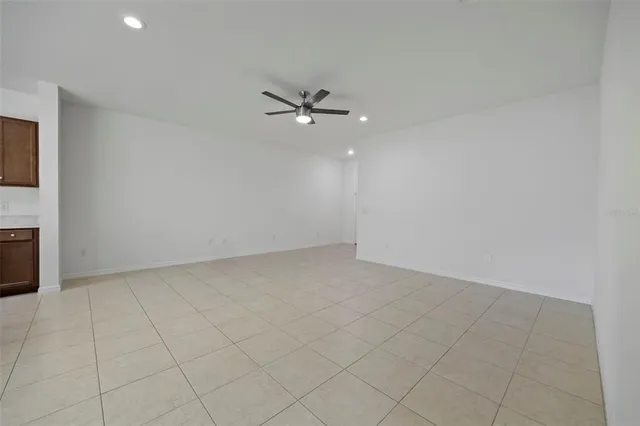 a kitchen with a stove a refrigerator and a sink