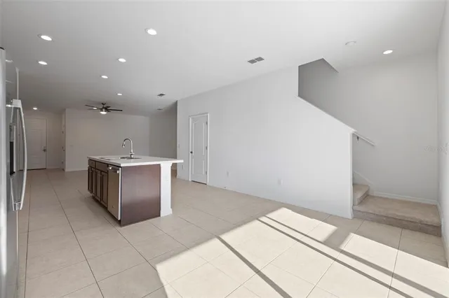 a stove top oven sitting inside of a kitchen