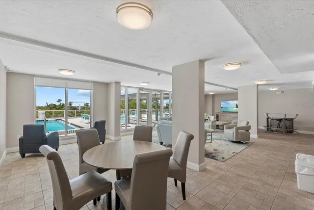 a view of a dining room with furniture window and outside view