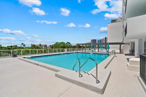 a view of a swimming pool with a lounge chairs